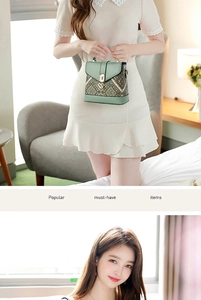 Detail of mint green crossbody bag with vintage geometric pattern and metal clasp
