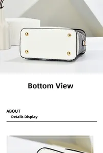 Close-up of the bottom of the white leather phone bag showing four golden metal studs