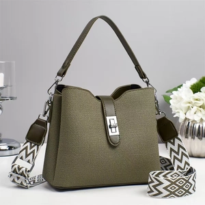 Army green trapezoid bucket bag with geometric wide strap and silver metal clasp