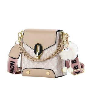 Beige leather and monogram canvas crossbody bag with chain strap and plush charm