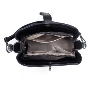 Top view of spacious bucket bag interior with grey herringbone lining and zippers
