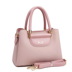 Pink woven handbag with golden NJS logo and detachable shoulder strap detail