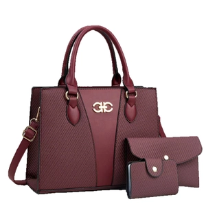 Three-piece burgundy tote bag set featuring large handbag, clutch, and wallet in textured PU