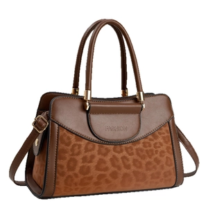 Women's brown handbag with leopard print panel, top handles and gold hardware details