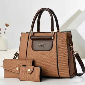 Three-piece brown woven tote bag set with matching leather trim and gold hardware details