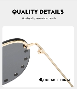 Close-up of durable golden metal hinge on black retro aviator sunglasses frame
