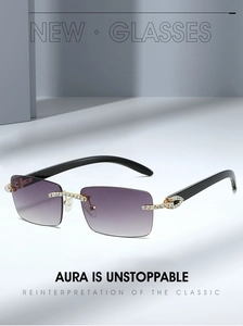 Detail of purple gradient lenses and gold-tone rhinestone hinge on rimless sunglasses