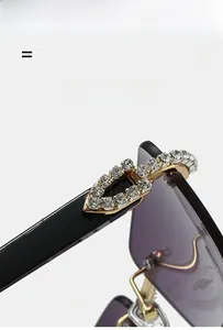 Detailed macro shot of rimless sunglasses with rhinestone leaves and wood grain arms