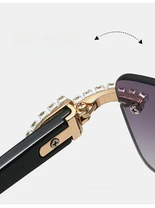 Detail of durable gold metal hinge with square rhinestones on rimless sunglasses