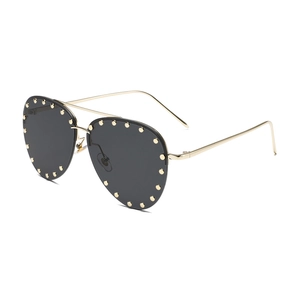 Classic aviator sunglasses with black lenses and gold studded rivet detailing