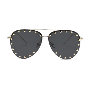 Classic aviator sunglasses with gold metal frame and rivet-studded dark lenses