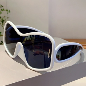 Detail of white wraparound Y2K sunglasses with oversized futuristic wave frame design