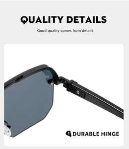Macro shot of durable metal hinge on semi-rimless sunglasses with dark lenses