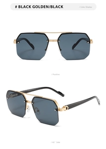 Close-up of semi-rimless sunglasses showing golden C-shaped hinges and black metal frames