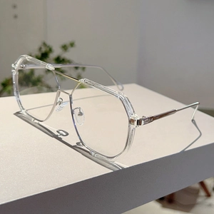Detail of transparent aviator sunglasses with silver metal temples and double bridge design