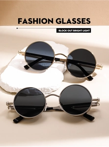 Detail view of steampunk sunglasses with metallic spring hinge and round lenses