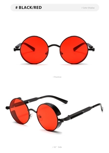 Detail view of steampunk round sunglasses with black frames, red lenses and spring temple design