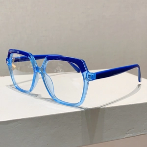 Detail of blue two-tone hexagonal frame glasses with reinforced metal hinges