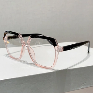 Detail of trendy two-tone pink and black oversized glasses on a geometric display