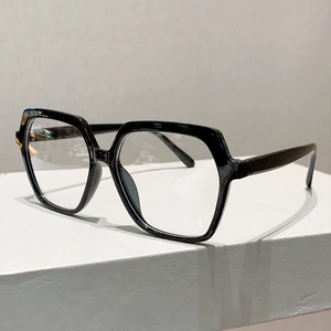Detail of black oversized polygon frames with sleek finish and anti-blue light lenses