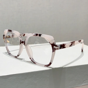 Close-up of hexagonal marble pattern glasses frame on a minimalist pedestal display
