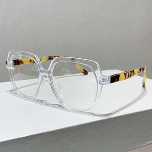 Detail view of transparent geometric frame glasses with stylish leopard print temples
