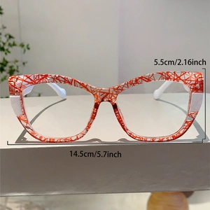 Detailed view of cat-eye frames with red and white patterns and 14.5cm width specs