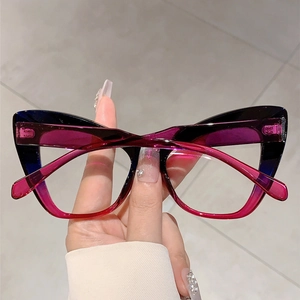 Detailed view of cat-eye glasses frame with blue to magenta vertical gradient colors