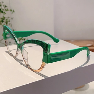 Detail of cat-eye glasses frame featuring green marble top and leopard print bottom