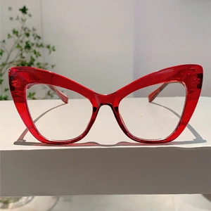 Front view of transparent red cat eye glasses with vintage oversized fashion frame