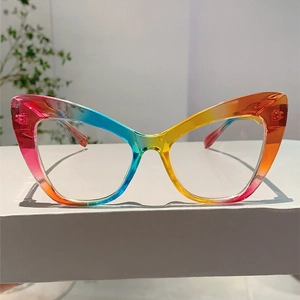 Detailed view of rainbow gradient cat eye glasses frame with vibrant transparent colors