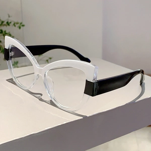 Detail view of stylish two-tone cat-eye glasses frame with white and clear contrast
