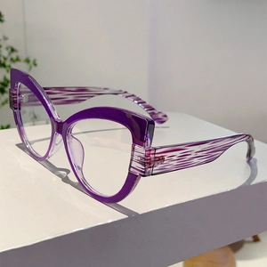 Detail of purple cat-eye frames with gradient finish and wavy patterned temple tips