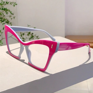 Detail view of cat eye frame with rose pink and light blue gray contrast design