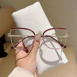 Detail of elegant cat-eye glasses frame with gradient finish and gold metal temples