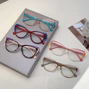Five pairs of trendy cat-eye blue light blocking glasses in vibrant color-blocked frames