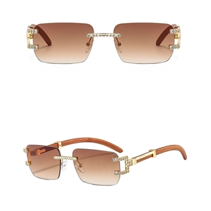 Details von Luxus-Randlos-Sonnenbrillen mit Verlaufsgläsern und goldenem Diamantbesatz