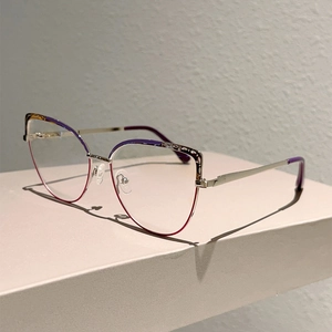 Detail of elegant cat-eye glasses frame with purple gradient finish and metal temples