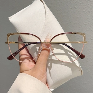 Elegant cat-eye blue light blocking glasses with gold hollow carving and pink metal frame