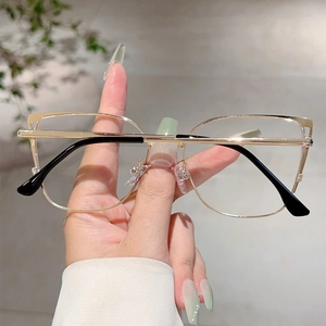 Detail of light gold cat-eye metal frame glasses with black anti-slip temple tips