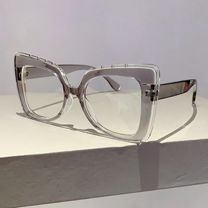 Detail of transparent cat-eye glasses frame with sleek grey translucent temples