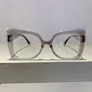 Macro detail of purple cat-eye blue light glasses with unique serrated edge frame