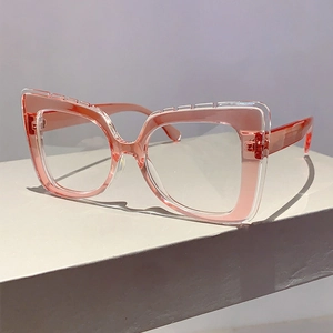 Detail of square pink transparent double-frame blue light glasses on white podium
