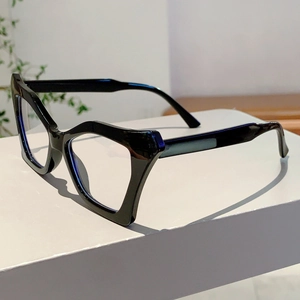 Side view of black butterfly cat-eye glasses with thick frames on a white pedestal