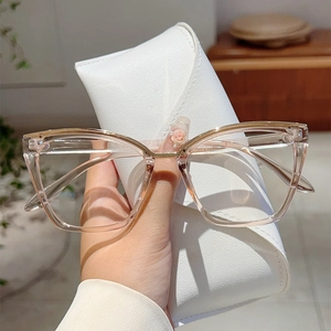 Elegant champagne cat-eye blue light glasses with gold metal and white leather case
