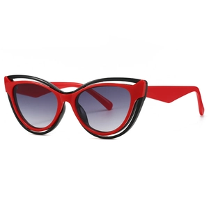 Fashionable cat-eye sunglasses with dual-layer red and black frames and gray gradient lenses