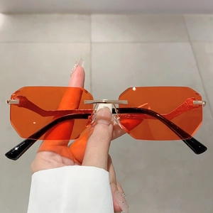 Frameless polygonal ocean lens sunglasses with leopard head accent and gold metal frames