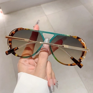Close-up of tortoise shell frame with rhinestone inlay and gold metal temples