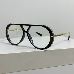 Detail of pilot glasses showing double bridge design and golden metal temples