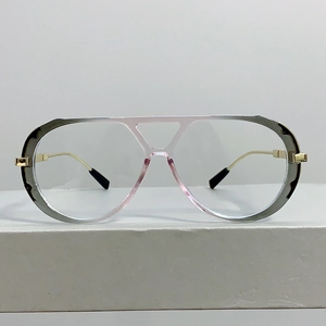 Macro view of transparent gradient frame with dual metal bridge on oversized eyewear